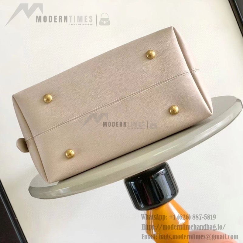 Louis Vuitton Low Key Hobo Bag in grained calfskin leather with adjustable shoulder strap