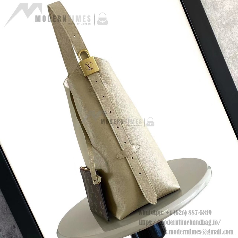 Louis Vuitton Low Key Hobo Bag in grained calfskin leather with adjustable shoulder strap