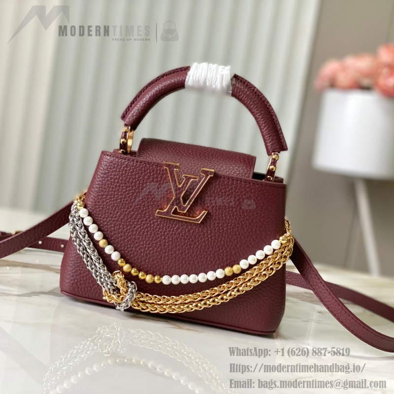 Louis Vuitton Capucines East-West Why Knot Taurillon leather handbag in mini and small sizes with Monogram beaded chain and shiny metal hardware