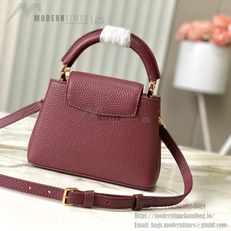 Louis Vuitton Capucines East-West Why Knot Taurillon leather handbag in mini and small sizes with Monogram beaded chain and shiny metal hardware