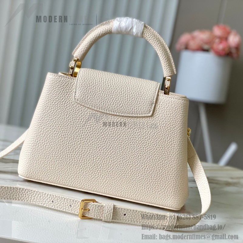 Louis Vuitton Capucines East-West Why Knot Taurillon leather handbag in mini and small sizes with Monogram beaded chain and shiny metal hardware