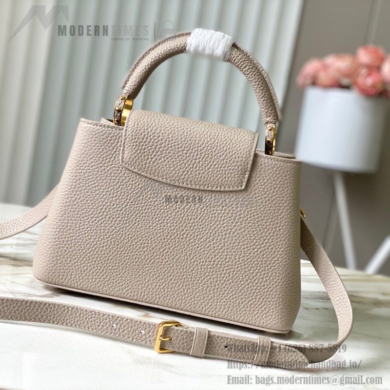 Louis Vuitton Capucines East-West Why Knot Taurillon leather handbag in mini and small sizes with Monogram beaded chain and shiny metal hardware