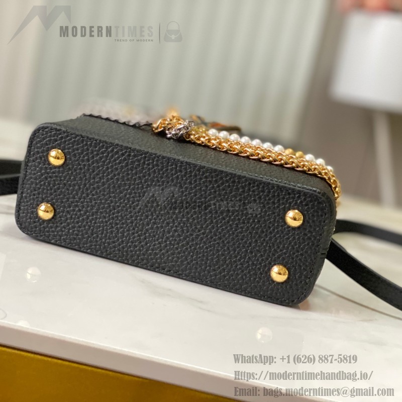 Louis Vuitton Capucines East-West Why Knot Taurillon leather handbag in mini and small sizes with Monogram beaded chain and shiny metal hardware