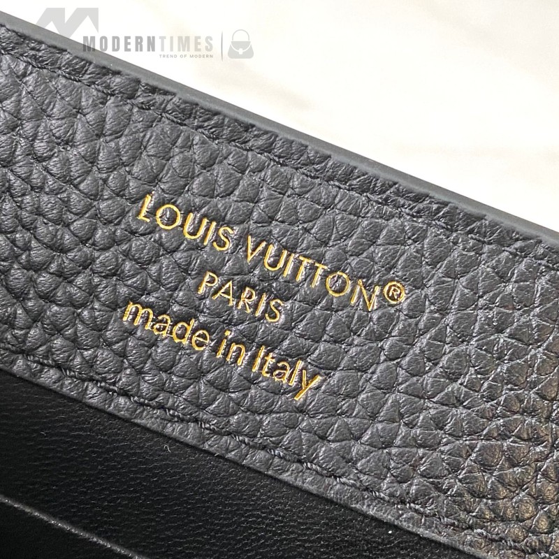 Louis Vuitton Capucines East-West Why Knot Taurillon leather handbag in mini and small sizes with Monogram beaded chain and shiny metal hardware