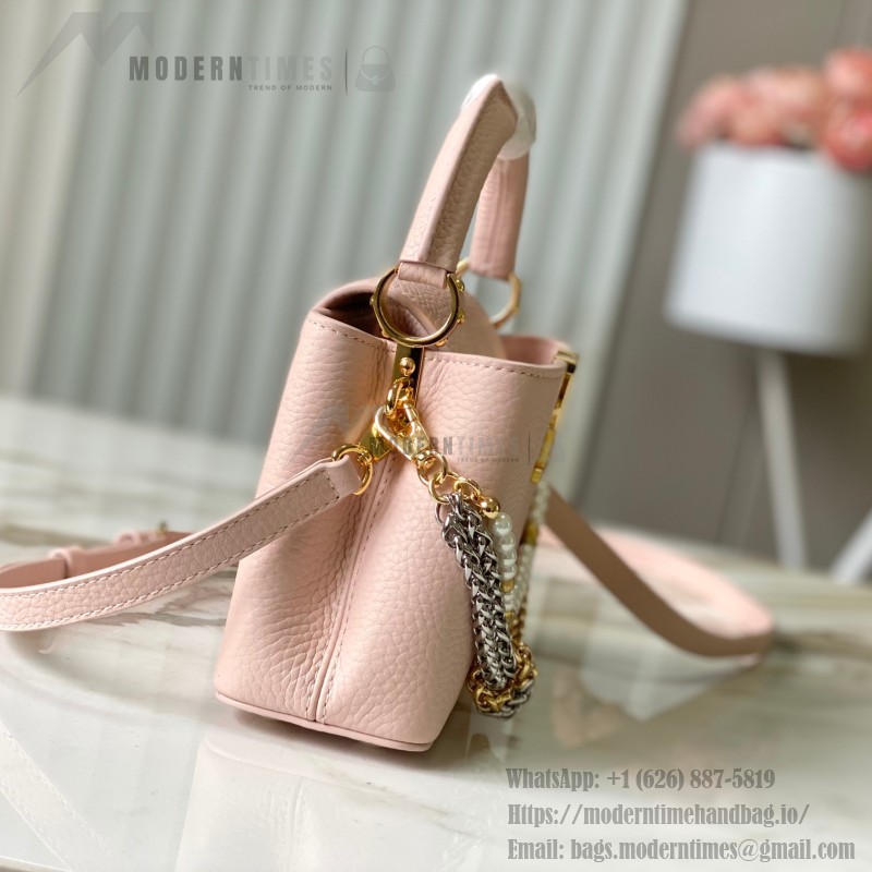 Louis Vuitton Capucines East-West Why Knot Taurillon leather handbag in mini and small sizes with Monogram beaded chain and shiny metal hardware