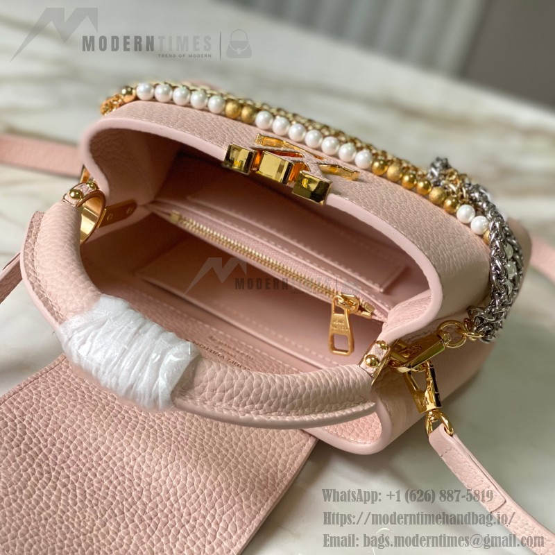 Louis Vuitton Capucines East-West Why Knot Taurillon leather handbag in mini and small sizes with Monogram beaded chain and shiny metal hardware
