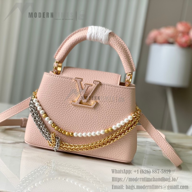Louis Vuitton Capucines East-West Why Knot Taurillon leather handbag in mini and small sizes with Monogram beaded chain and shiny metal hardware