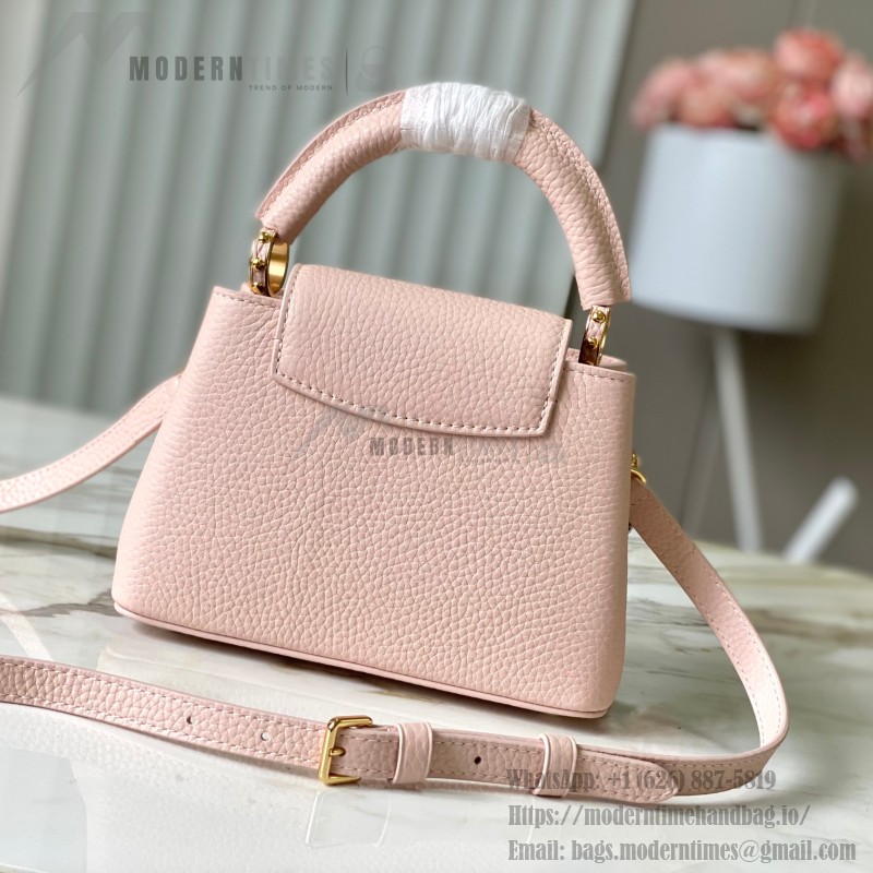 Louis Vuitton Capucines East-West Why Knot Taurillon leather handbag in mini and small sizes with Monogram beaded chain and shiny metal hardware