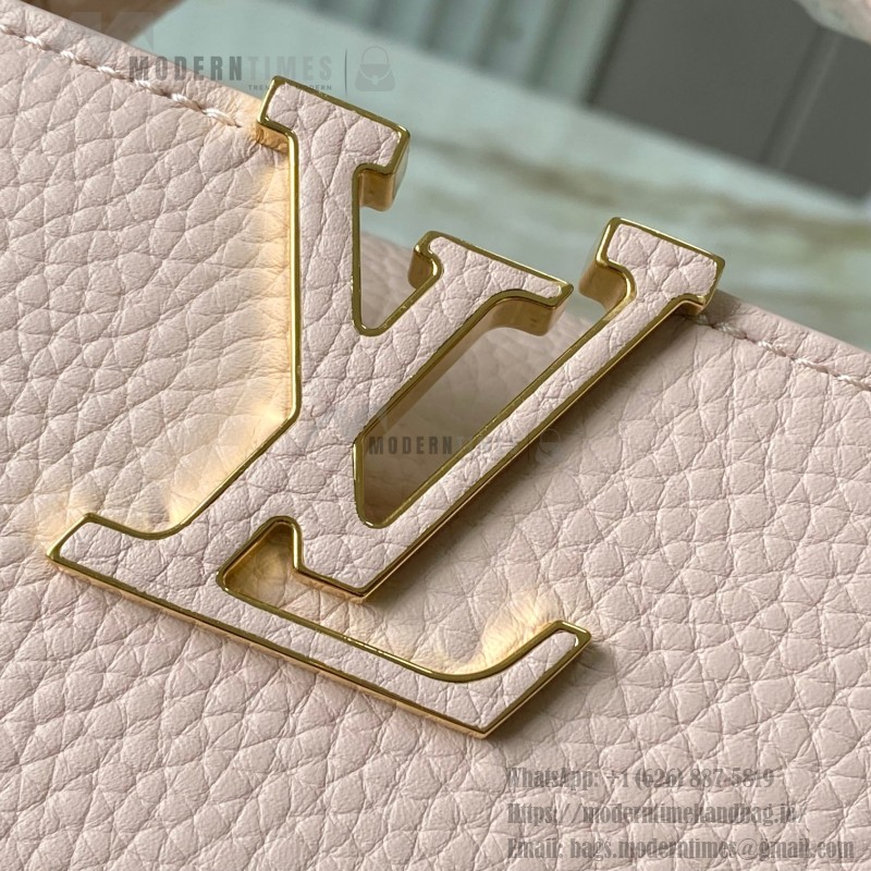Louis Vuitton Capucines East-West Why Knot Taurillon leather handbag in mini and small sizes with Monogram beaded chain and shiny metal hardware