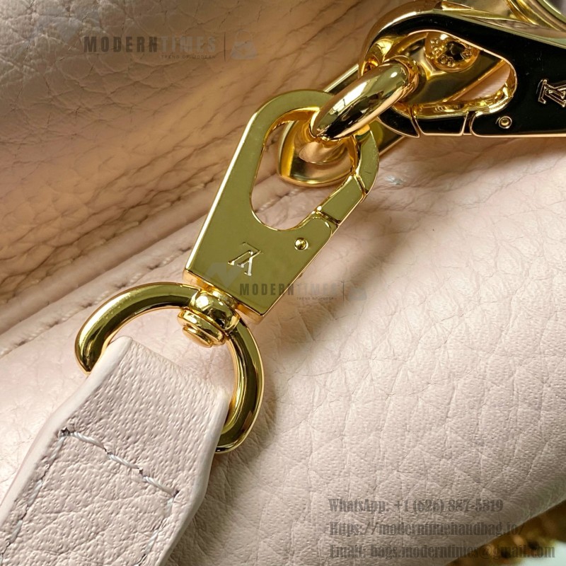 Louis Vuitton Capucines East-West Why Knot Taurillon leather handbag in mini and small sizes with Monogram beaded chain and shiny metal hardware