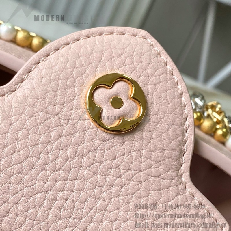 Louis Vuitton Capucines East-West Why Knot Taurillon leather handbag in mini and small sizes with Monogram beaded chain and shiny metal hardware