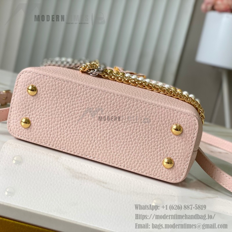 Louis Vuitton Capucines East-West Why Knot Taurillon leather handbag in mini and small sizes with Monogram beaded chain and shiny metal hardware