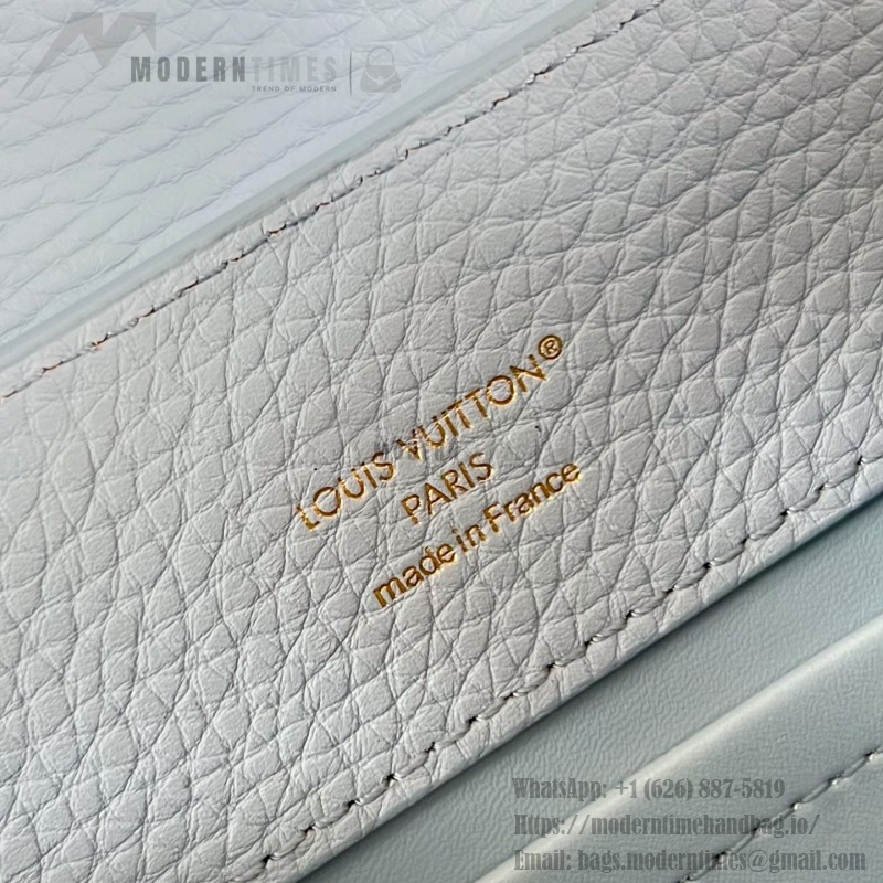 Louis Vuitton Capucines East-West Why Knot Taurillon leather handbag in mini and small sizes with Monogram beaded chain and shiny metal hardware