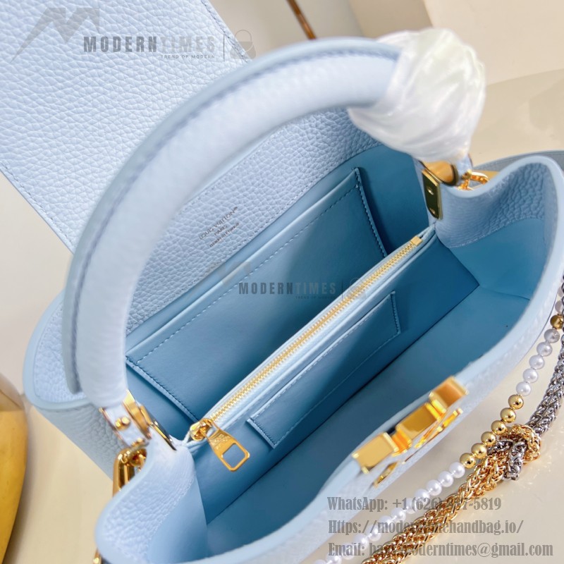Louis Vuitton Capucines East-West Why Knot Taurillon leather handbag in mini and small sizes with Monogram beaded chain and shiny metal hardware