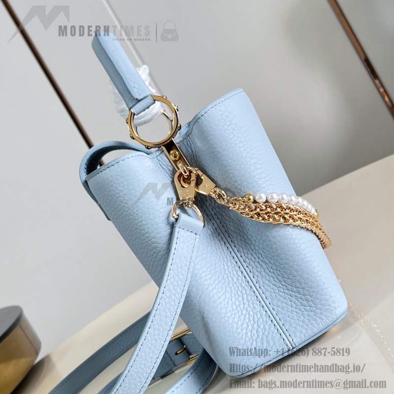 Louis Vuitton Capucines East-West Why Knot Taurillon leather handbag in mini and small sizes with Monogram beaded chain and shiny metal hardware