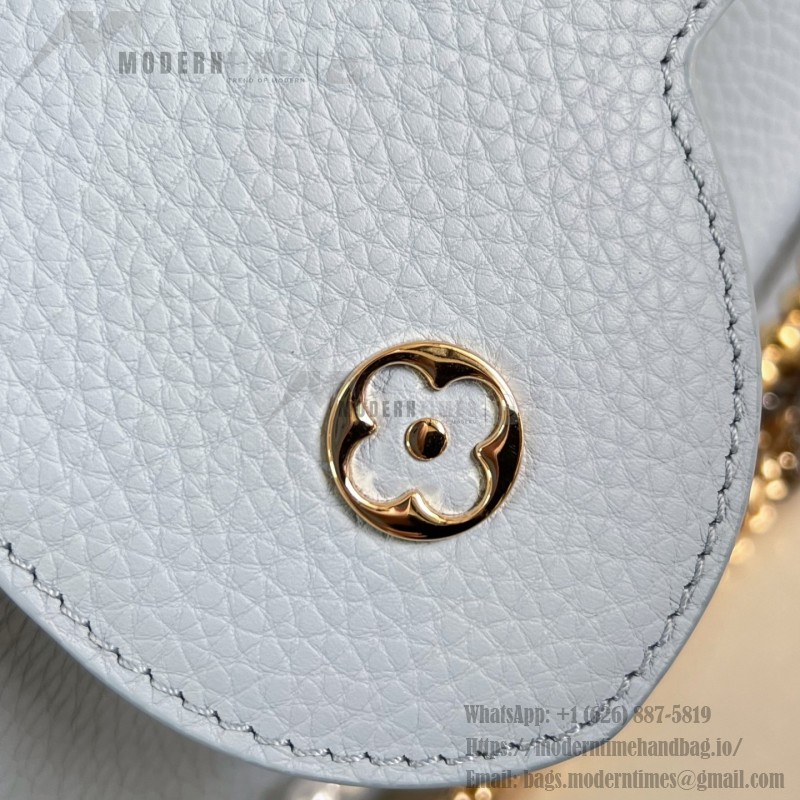 Louis Vuitton Capucines East-West Why Knot Taurillon leather handbag in mini and small sizes with Monogram beaded chain and shiny metal hardware