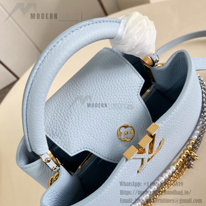 Louis Vuitton Capucines East-West Why Knot Taurillon leather handbag in mini and small sizes with Monogram beaded chain and shiny metal hardware