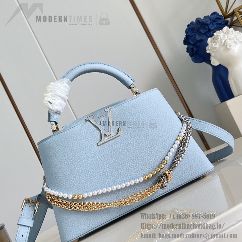 Louis Vuitton Capucines East-West Why Knot Taurillon leather handbag in mini and small sizes with Monogram beaded chain and shiny metal hardware