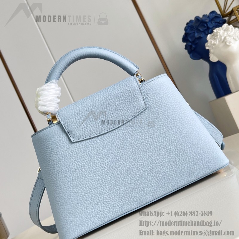 Louis Vuitton Capucines East-West Why Knot Taurillon leather handbag in mini and small sizes with Monogram beaded chain and shiny metal hardware