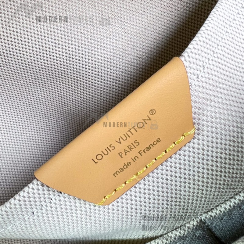 Louis Vuitton Discovery PM M29769 Monogram Surplus backpack with leather trim and front zip pocket