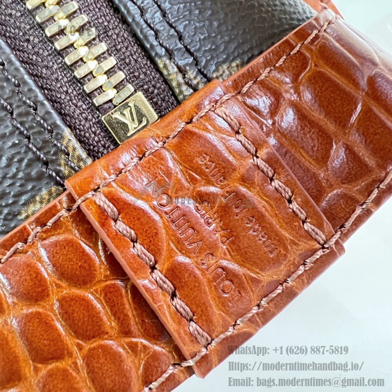 Louis Vuitton Alma BB M53152 Monogram canvas handbag with crocodile-embossed leather trim, Toron handles, padlock, and adjustable shoulder strap