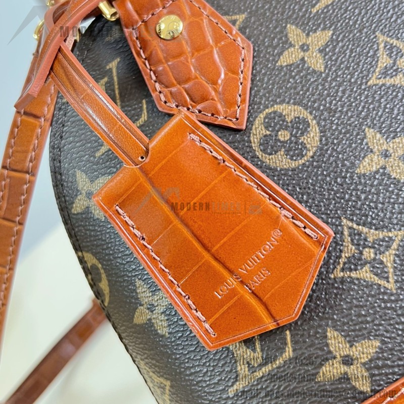 Louis Vuitton Alma BB M53152 Monogram canvas handbag with crocodile-embossed leather trim, Toron handles, padlock, and adjustable shoulder strap