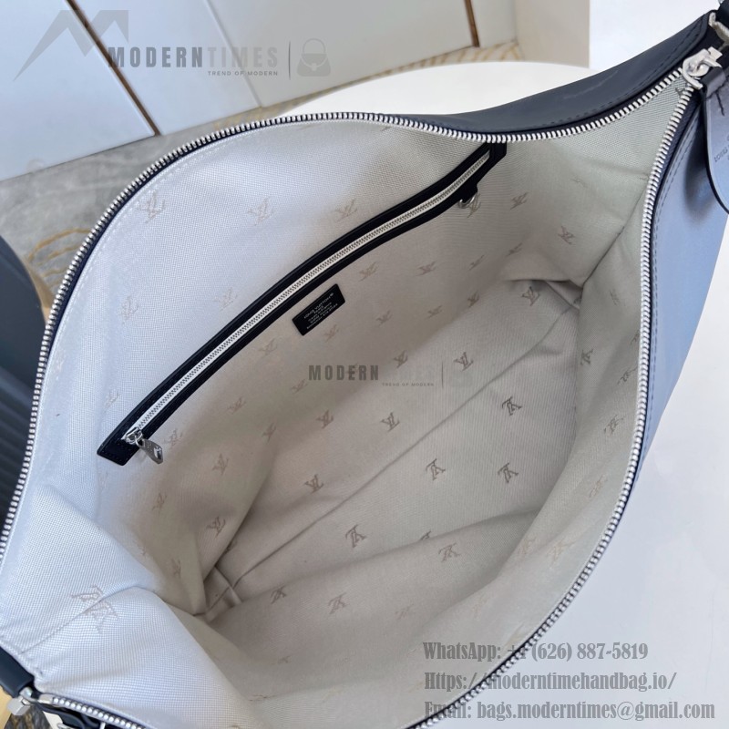 Louis Vuitton Vagabond Hobo M28392 soft tanned leather shoulder bag with an adjustable woven strap, padlock, and LV Blason jacquard lining