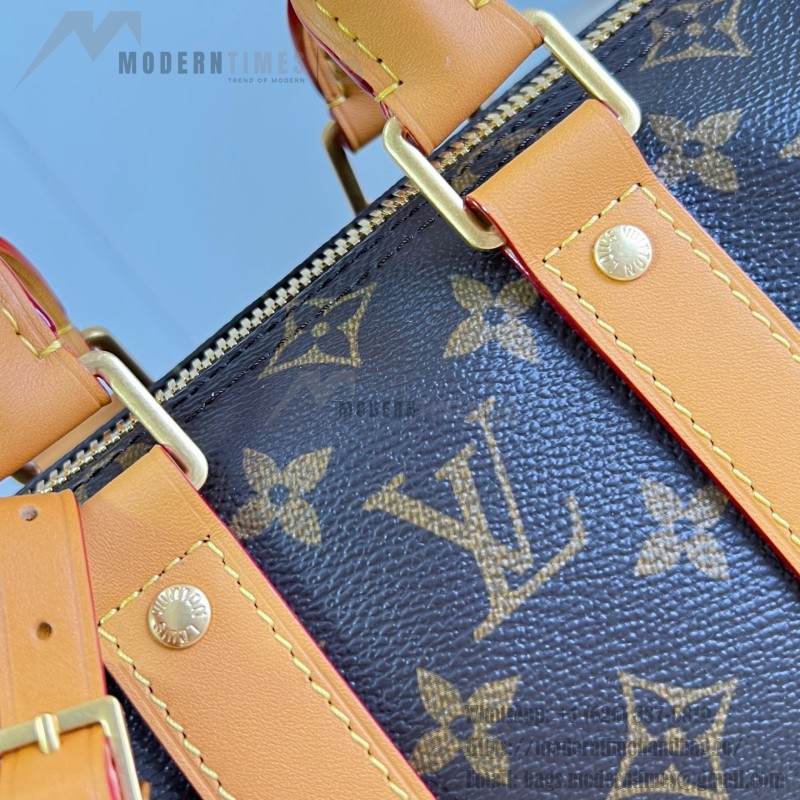Louis Vuitton Keepall Bandoulière 25 M28957 Monogram Archive coated canvas bag with cowhide leather trim, aged metal hardware, top handle, and adjustable strap
