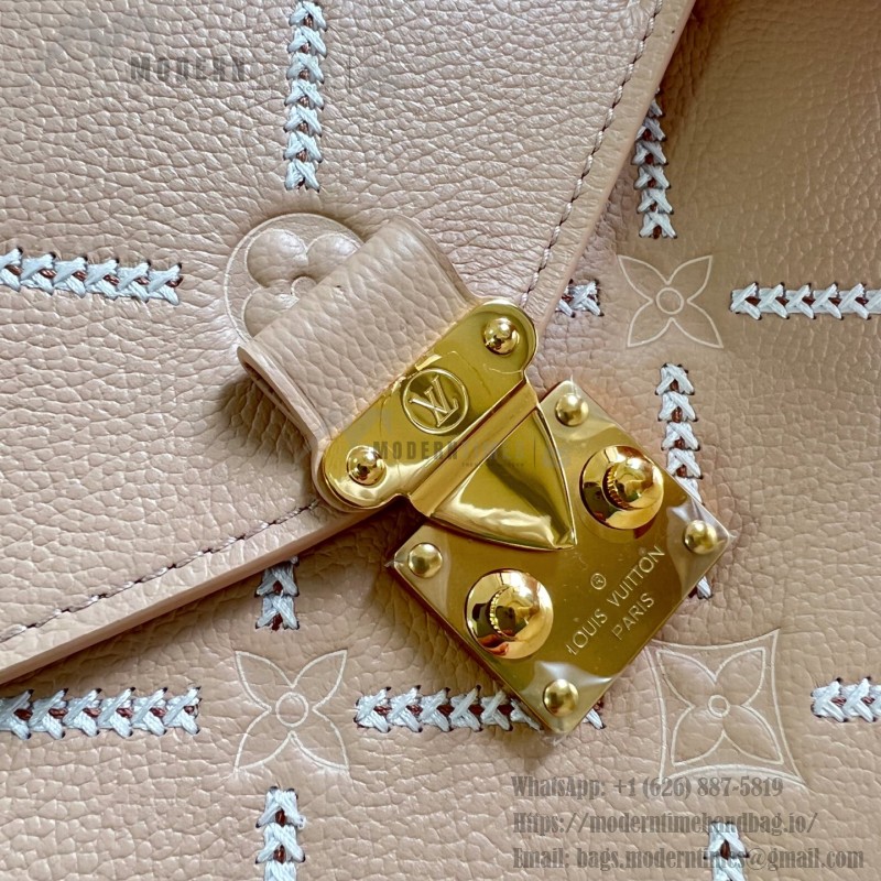 Louis Vuitton Pochette Métis M29497 Monogram Empreinte leather handbag with S-lock closure
