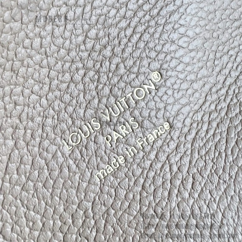 Louis Vuitton Pochette Métis M29497 Monogram Empreinte leather handbag with S-lock closure