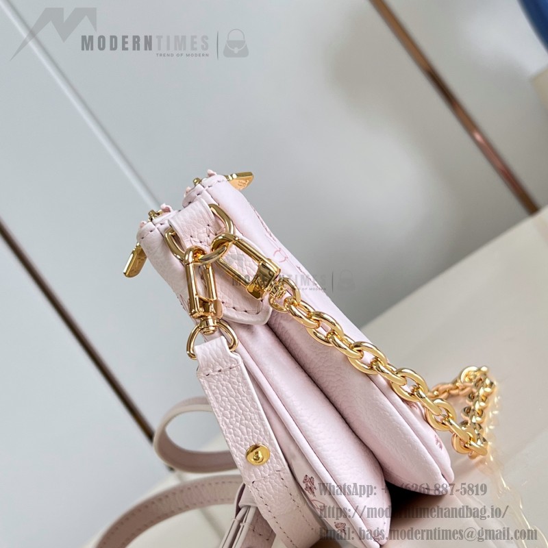 Louis Vuitton Liv Pochette M29495 Monogram Empreinte leather handbag with gold chain and double zip closure