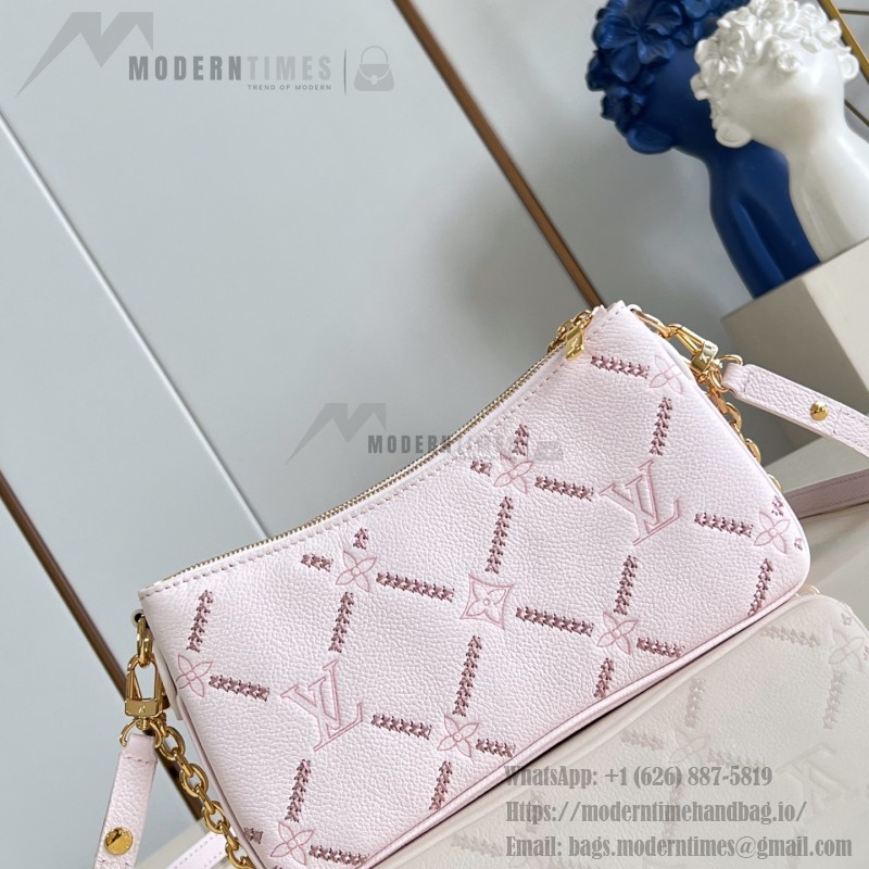Louis Vuitton Liv Pochette M29495 Monogram Empreinte leather handbag with gold chain and double zip closure