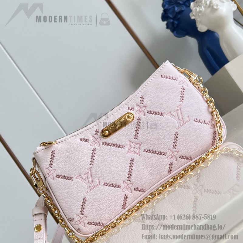Louis Vuitton Liv Pochette M29495 Monogram Empreinte leather handbag with gold chain and double zip closure