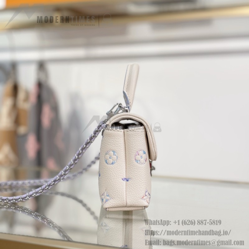 Louis Vuitton Nano Madeleine M2A374 premium fabric handbag with durable metal hardware