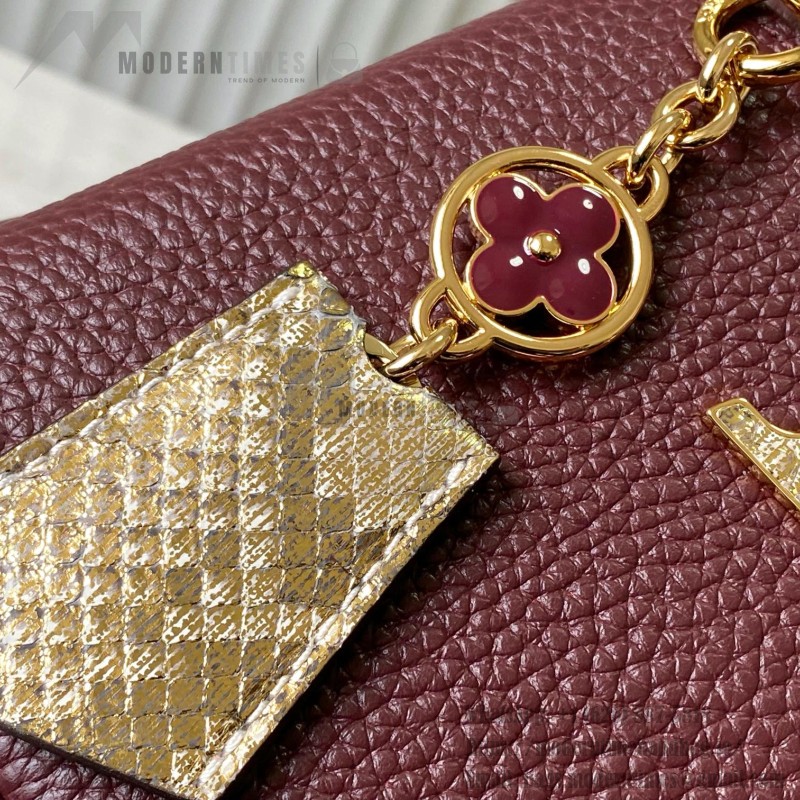 Louis Vuitton Capucines Bag in Burgundy with Golden Snake Handle and Monogram Chain