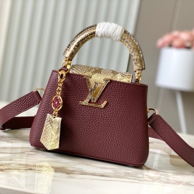 Louis Vuitton - Capucines Bag in Burgundy with Golden Snake Embellishment