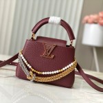 Louis Vuitton Capucines East-West Why Knot Taurillon leather handbag in mini and small sizes with Monogram beaded chain and shiny metal hardware