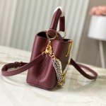 Louis Vuitton Capucines East-West Why Knot Taurillon leather handbag in mini and small sizes with Monogram beaded chain and shiny metal hardware