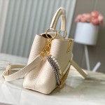 Louis Vuitton Capucines East-West Why Knot Taurillon leather handbag in mini and small sizes with Monogram beaded chain and shiny metal hardware