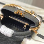 Louis Vuitton Capucines East-West Why Knot Taurillon leather handbag in mini and small sizes with Monogram beaded chain and shiny metal hardware