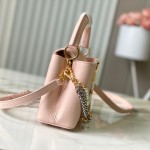 Louis Vuitton Capucines East-West Why Knot Taurillon leather handbag in mini and small sizes with Monogram beaded chain and shiny metal hardware