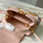 Louis Vuitton Capucines East-West Why Knot Taurillon leather handbag in mini and small sizes with Monogram beaded chain and shiny metal hardware