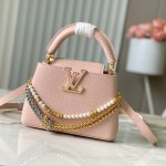 Louis Vuitton Capucines East-West Why Knot Taurillon leather handbag in mini and small sizes with Monogram beaded chain and shiny metal hardware