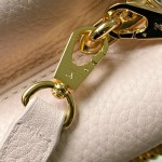 Louis Vuitton Capucines East-West Why Knot Taurillon leather handbag in mini and small sizes with Monogram beaded chain and shiny metal hardware
