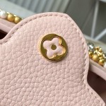 Louis Vuitton Capucines East-West Why Knot Taurillon leather handbag in mini and small sizes with Monogram beaded chain and shiny metal hardware