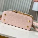 Louis Vuitton Capucines East-West Why Knot Taurillon leather handbag in mini and small sizes with Monogram beaded chain and shiny metal hardware