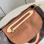 Louis Vuitton Speedy Bandoulière 25 Handbag with Monogram Canvas and Leather Handle