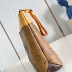 Louis Vuitton Pochette Voyage Souple M26015 in Monogram coated canvas with Boro patchwork, Damier, and Monogram Reverse canvas accents