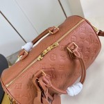Louis Vuitton Speedy Soft 30 Handbag with Monogram Empreinte Leather and Suede Lining