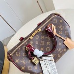 Louis Vuitton Speedy Soft 30 Monogram Anniversary handbag in Monogram canvas with leather trim and travel-inspired accessories